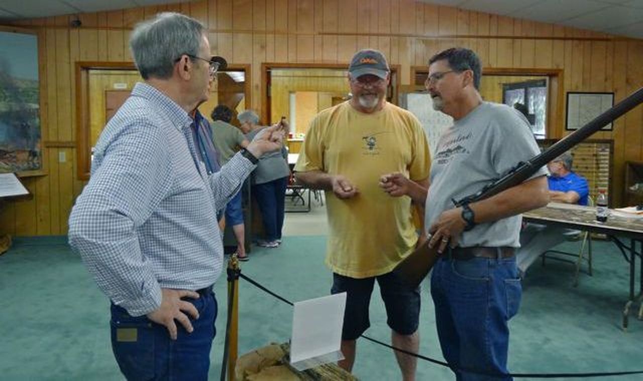 Jerry Leatherman, president of the board, discussing history with visitors.