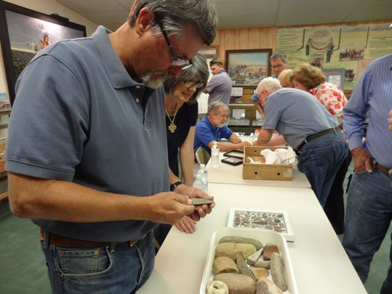Archaeological experts Rick Day and Paul Katz at the artifact table.