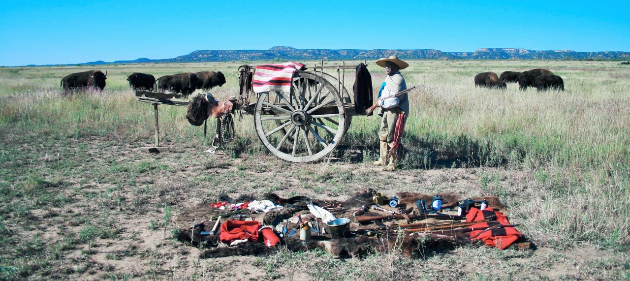 Henry Crawford, living history interpreter, dressed as a Comanchero with a carreta (cart) and trade goods.